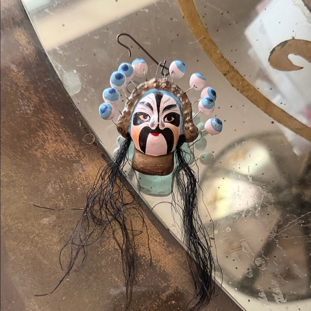 Handcrafted Mask Ornament with Blue Accents